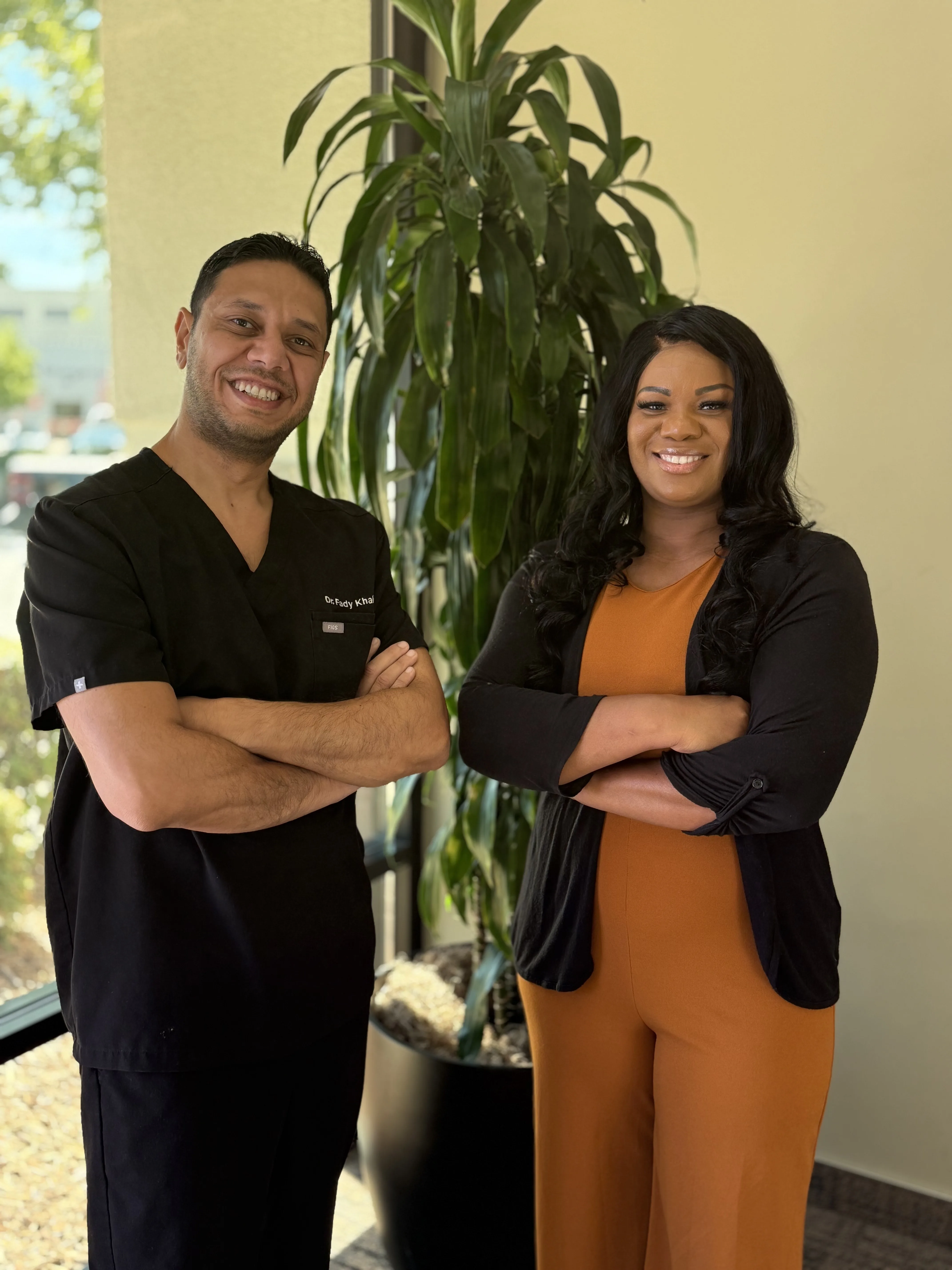 Dr. Fady Khalil with patients at Delight Dental Group
